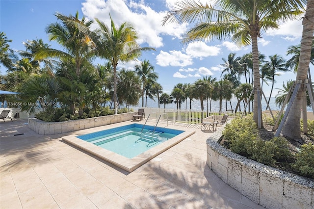 1 Grove Isle Dr Unit A409, Miami, FL 33133 - view of swimming pool featuring a hot tub and a patio area