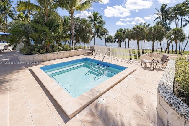 1 Grove Isle Dr Unit A409, Miami, FL 33133 - view of swimming pool with a water view, a patio area, and a hot tub