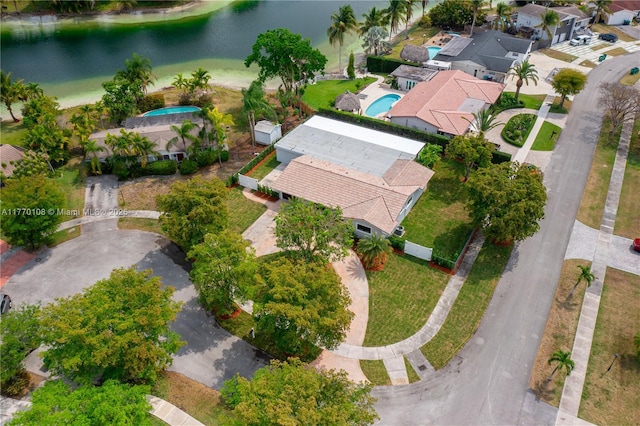 birds eye view of property featuring a residential view and a water view