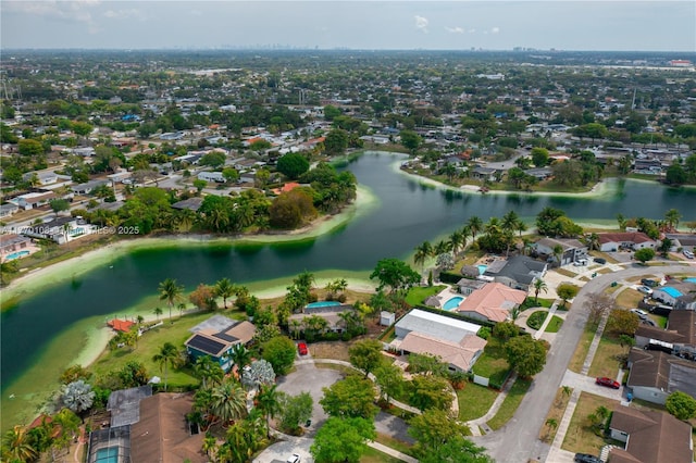 bird's eye view with a residential view and a water view