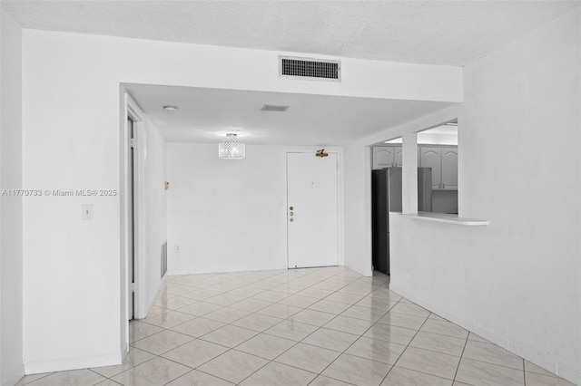 9273 Collins Ave Unit 607, Surfside, FL 33154 - empty room featuring visible vents, light tile patterned floors, and a textured ceiling