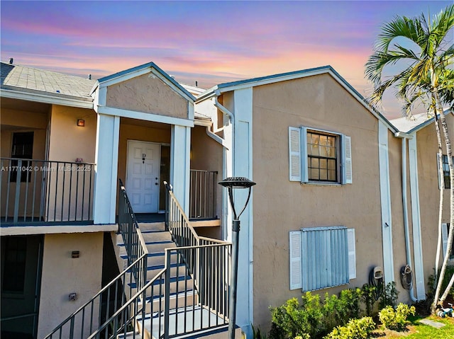 1140 Independence Trl Unit 1140-D, Homestead, FL 33034 - view of front of property with stucco siding and stairway