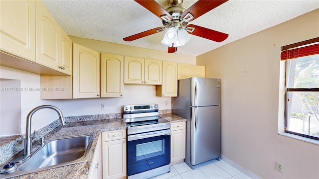 1140 Independence Trl Unit 1140-D, Homestead, FL 33034 - kitchen featuring cream cabinets, a sink, stainless steel appliances, and a wealth of natural light
