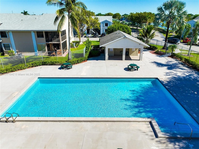 1140 Independence Trl Unit 1140-D, Homestead, FL 33034 - pool with fence, a residential view, and a patio area