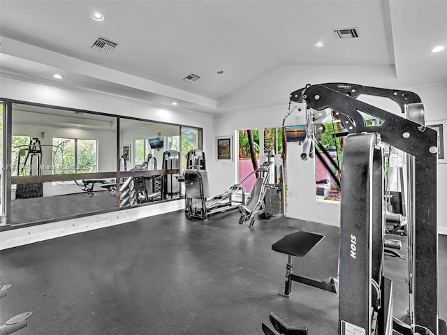 gym with vaulted ceiling and recessed lighting