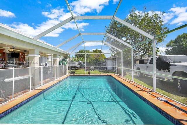 8480 Caribbean Blvd, Cutler Bay, FL 33157 - outdoor pool with glass enclosure and a patio area