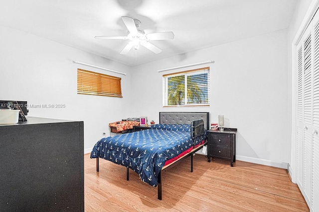 8480 Caribbean Blvd, Cutler Bay, FL 33157 - bedroom featuring baseboards, ceiling fan, wood finished floors, and a closet