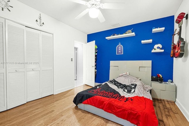 8480 Caribbean Blvd, Cutler Bay, FL 33157 - bedroom with a closet, wood finished floors, baseboards, visible vents, and ceiling fan