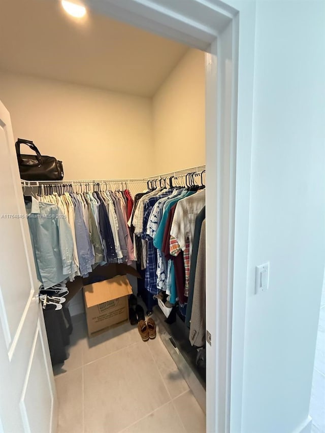 walk in closet featuring tile patterned flooring