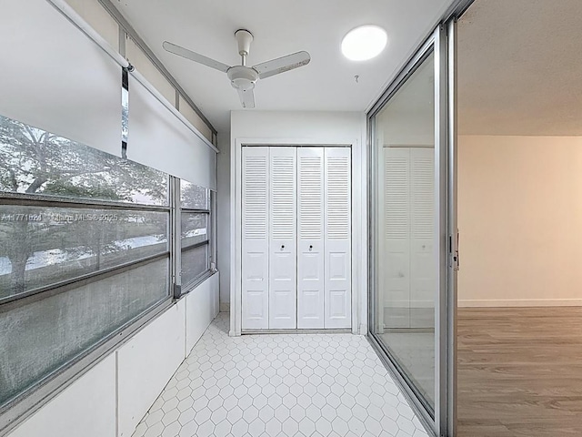 interior space featuring ceiling fan