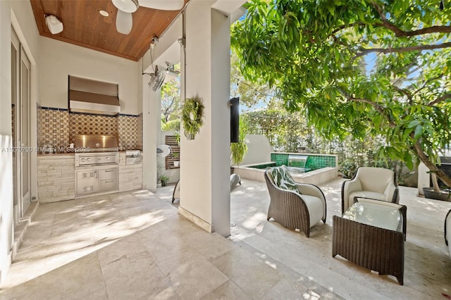 view of patio / terrace featuring an outdoor pool, exterior kitchen, a grill, and ceiling fan