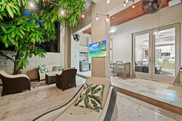view of patio / terrace with an outdoor living space and french doors