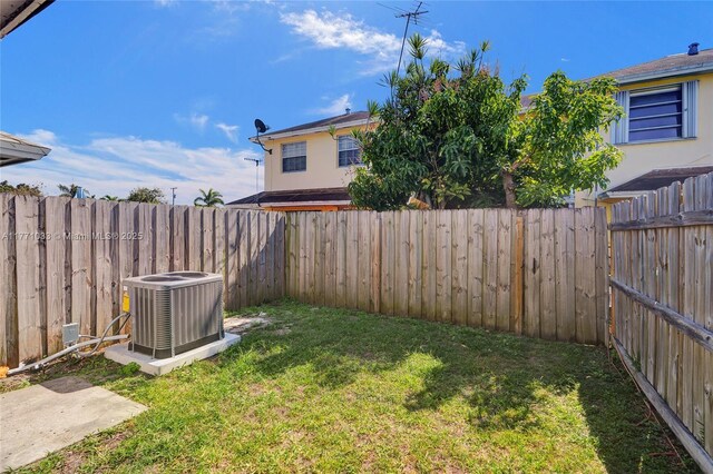 view of yard featuring cooling unit and a fenced backyard