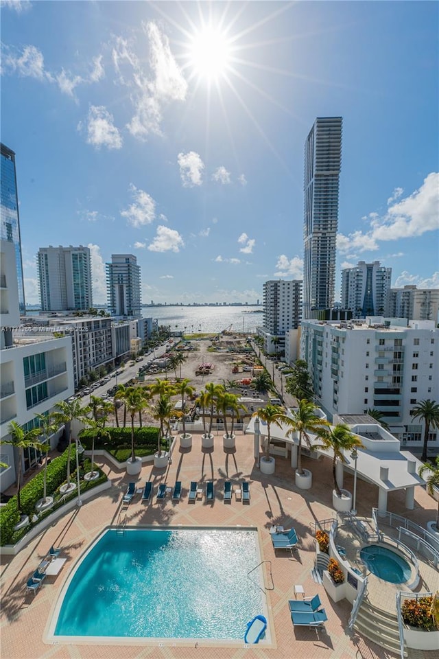 view of pool featuring a city view