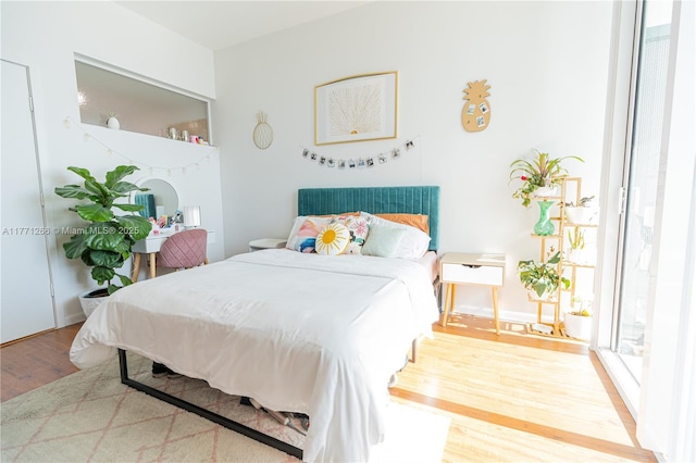 bedroom featuring wood finished floors