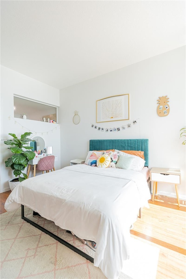 bedroom with wood finished floors