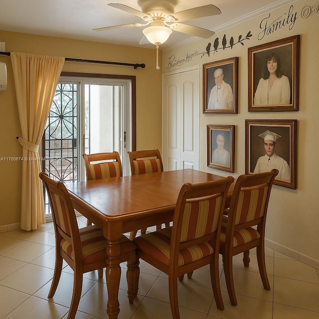 dining area featuring light tile patterned flooring, baseboards, and ceiling fan