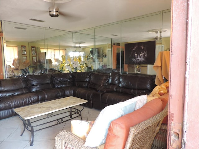 tiled living room featuring visible vents