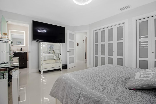 tiled bedroom featuring visible vents and baseboards