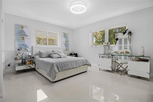 tiled bedroom with multiple windows