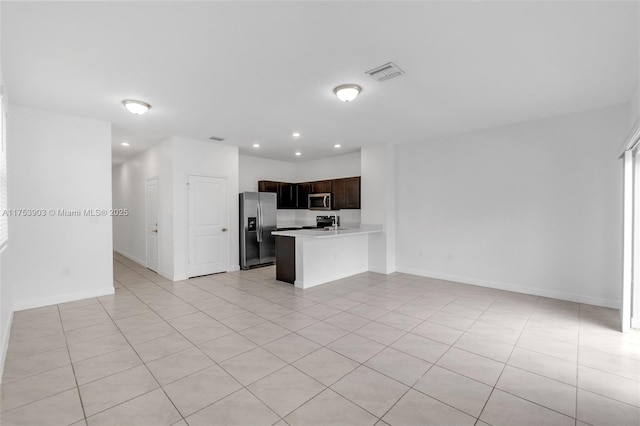 unfurnished living room with baseboards, visible vents, recessed lighting, and light tile patterned flooring