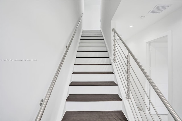 63 NW 4th Ave, Delray Beach, FL 33444 - stairway featuring visible vents, wood finished floors, and recessed lighting