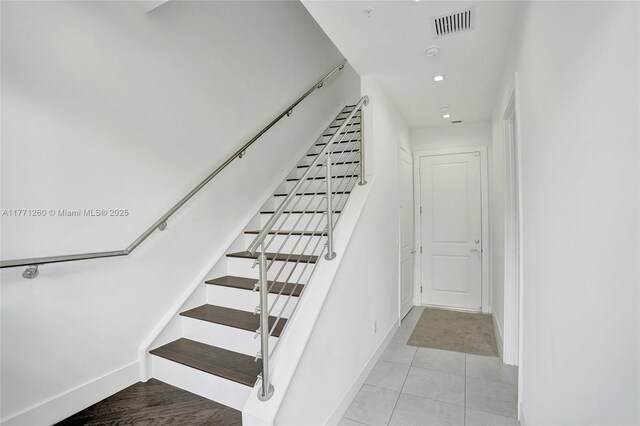 63 NW 4th Ave, Delray Beach, FL 33444 - stairway with baseboards and visible vents