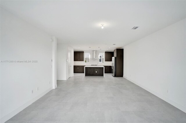 63 NW 4th Ave, Delray Beach, FL 33444 - unfurnished living room with recessed lighting, baseboards, and visible vents