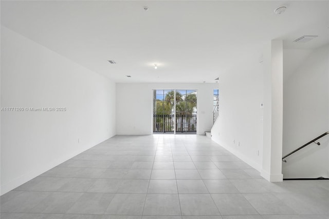63 NW 4th Ave, Delray Beach, FL 33444 - empty room featuring light tile patterned floors and visible vents