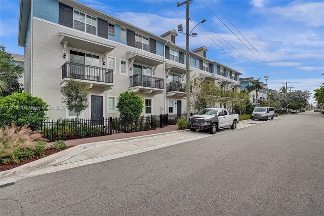 63 NW 4th Ave, Delray Beach, FL 33444 - view of property featuring fence and a residential view