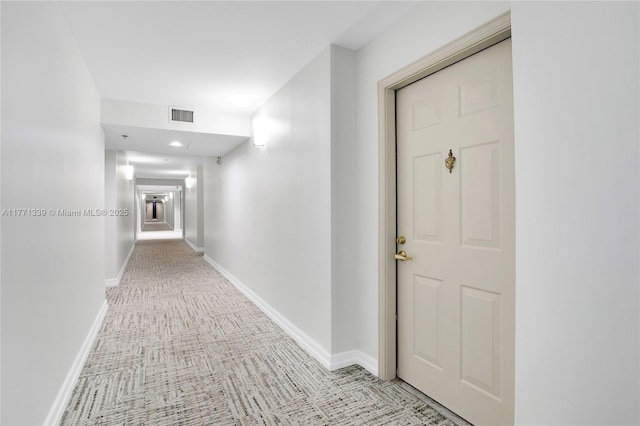 2665 SW 37th Ave Unit 1404, Miami, FL 33133 - corridor with light colored carpet and recessed lighting