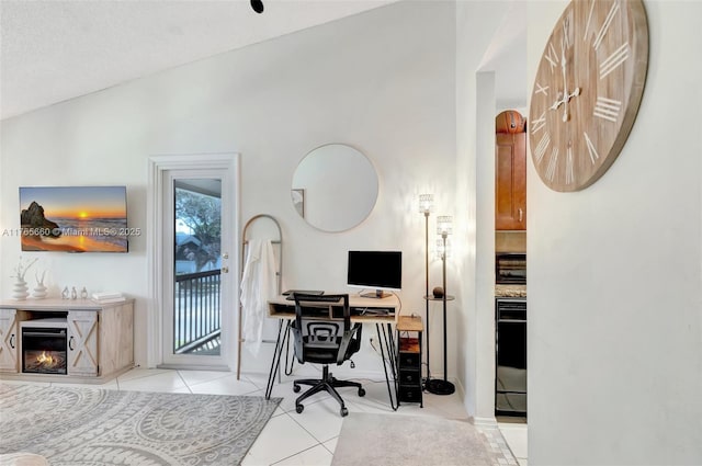 2307 N Congress Ave Unit 28, Boynton Beach, FL 33426 - home office with light tile patterned floors and a glass covered fireplace