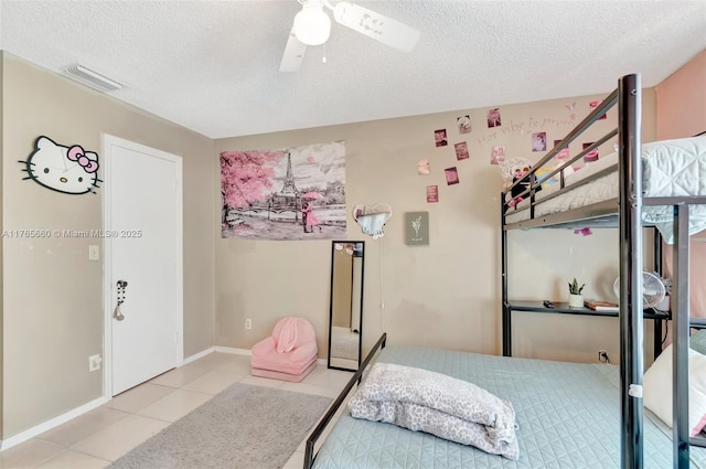 2307 N Congress Ave Unit 28, Boynton Beach, FL 33426 - tiled bedroom with a textured ceiling, ceiling fan, and baseboards