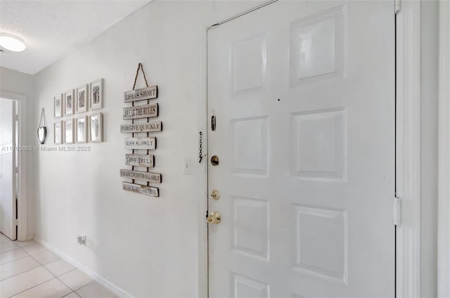 2307 N Congress Ave Unit 28, Boynton Beach, FL 33426 - entryway featuring baseboards and light tile patterned floors