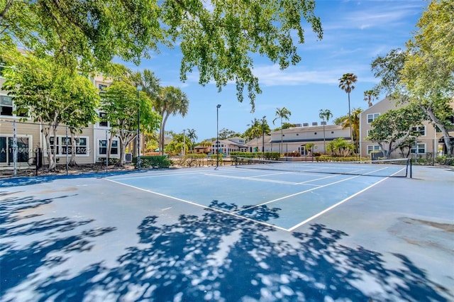 2307 N Congress Ave Unit 28, Boynton Beach, FL 33426 - view of tennis court with fence and a residential view