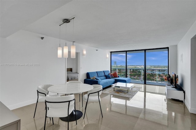 20515 E Country Club Dr Unit 1641, Aventura, FL 33180 - dining space featuring a wall of windows and baseboards
