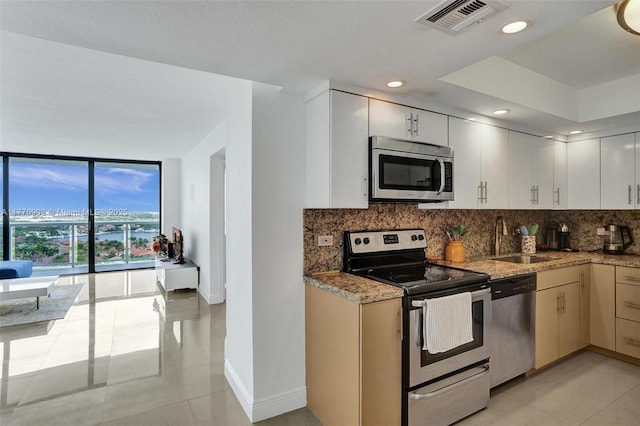 20515 E Country Club Dr Unit 1641, Aventura, FL 33180 - kitchen featuring a sink, tasteful backsplash, appliances with stainless steel finishes, and visible vents