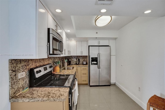 20515 E Country Club Dr Unit 1641, Aventura, FL 33180 - kitchen with recessed lighting, stainless steel appliances, decorative backsplash, a sink, and visible vents