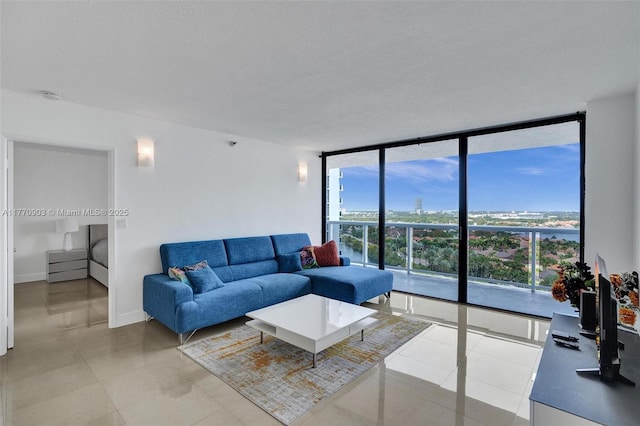 20515 E Country Club Dr Unit 1641, Aventura, FL 33180 - living area featuring floor to ceiling windows, light tile patterned floors, and baseboards