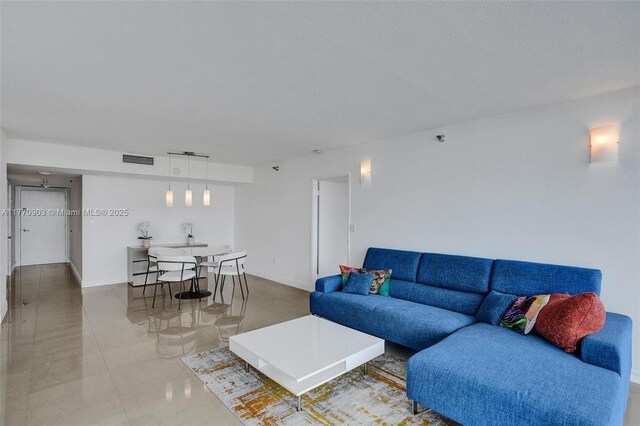 20515 E Country Club Dr Unit 1641, Aventura, FL 33180 - living room featuring baseboards and visible vents