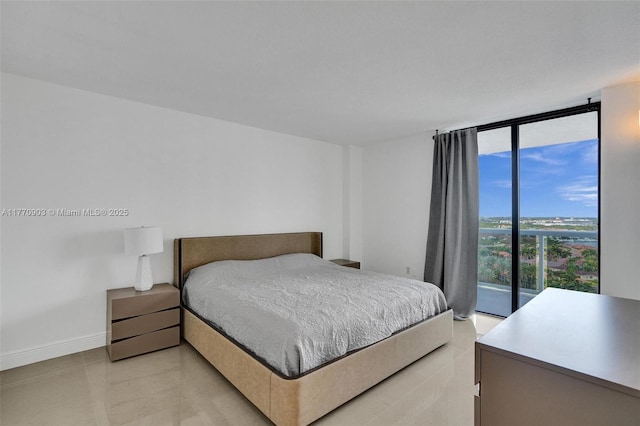 20515 E Country Club Dr Unit 1641, Aventura, FL 33180 - bedroom with light tile patterned floors, baseboards, and a wall of windows