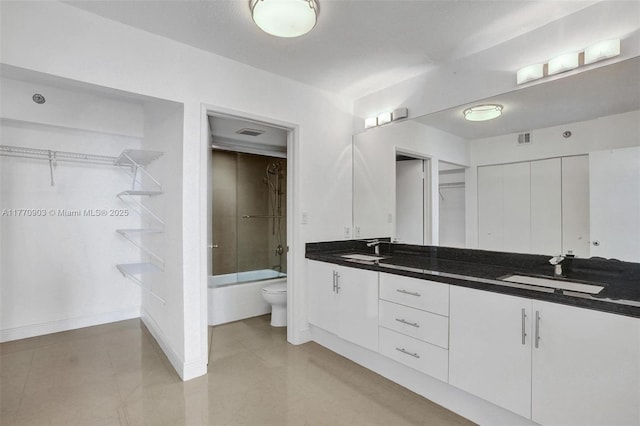 20515 E Country Club Dr Unit 1641, Aventura, FL 33180 - bathroom featuring double vanity, shower / bath combination with glass door, toilet, and a sink
