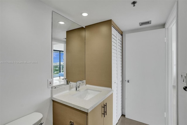 20515 E Country Club Dr Unit 1641, Aventura, FL 33180 - bathroom featuring visible vents, toilet, recessed lighting, and vanity