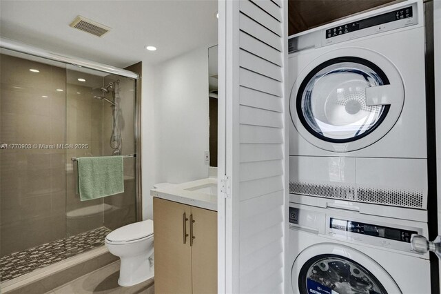 20515 E Country Club Dr Unit 1641, Aventura, FL 33180 - laundry room with visible vents, stacked washer and clothes dryer, laundry area, and recessed lighting