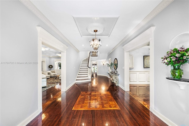 3916 Granada Blvd, Coral Gables, FL 33134 - entryway featuring stairs, ornamental molding, wood finished floors, and a raised ceiling