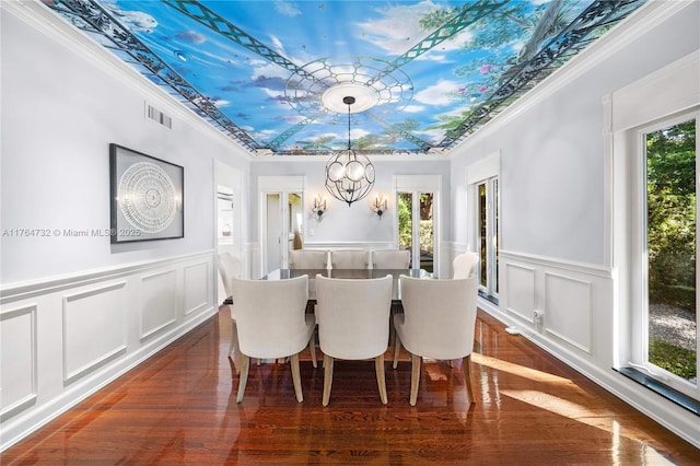 3916 Granada Blvd, Coral Gables, FL 33134 - dining area with visible vents, plenty of natural light, a notable chandelier, and a raised ceiling