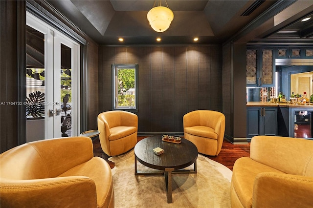 3916 Granada Blvd, Coral Gables, FL 33134 - interior space featuring wood finished floors, bar area, beverage cooler, a tray ceiling, and french doors