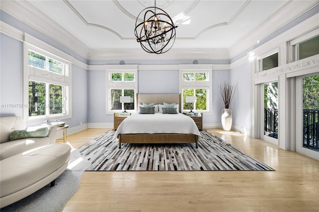 3916 Granada Blvd, Coral Gables, FL 33134 - bedroom with crown molding, baseboards, access to outside, a notable chandelier, and wood finished floors