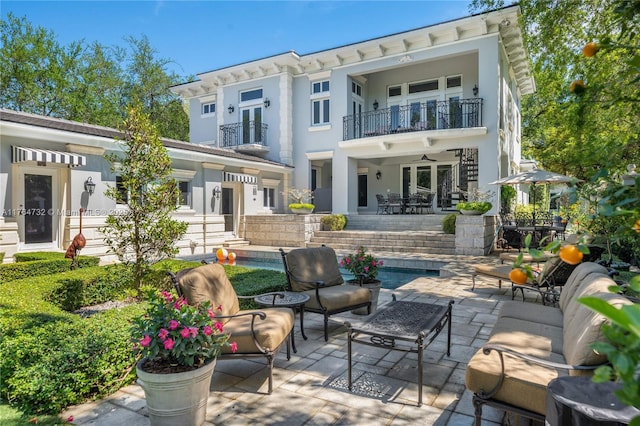 3916 Granada Blvd, Coral Gables, FL 33134 - back of property with a balcony, stucco siding, a patio, and outdoor lounge area