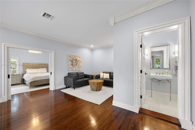 3916 Granada Blvd, Coral Gables, FL 33134 - sitting room featuring baseboards, visible vents, crown molding, and wood finished floors